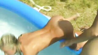 Lesbians have fun with a dildo at pool party - 12 image