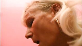 Petite brunette lesbian and older woman play with vibrator