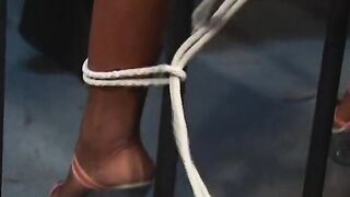 Black chick with great tits tied to jail cell's iron bars