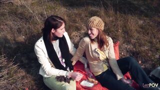 Sharing a gentle kiss outdoors the lesbian couple gets heated and they take out their strapon - 3 image