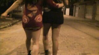 Two Naughty Girls Showing off on the Streets and Sucking on the Beach - 2 image