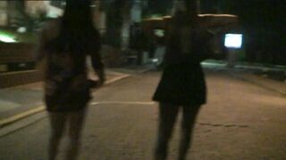 Two Naughty Girls Showing off on the Streets and Sucking on the Beach - 5 image