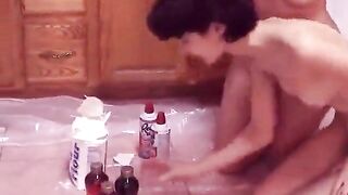 Girls get hot for each other and paint each other's nice tits on kitchen floor