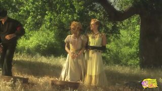 Blondes in the wild west in an open field get naked and have lesbian sex