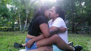HOT LESBIANS KISS AND TOUCH EACH OTHER OUTDOORS IN A PUBLIC PARK - 3 image