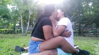 HOT LESBIANS KISS AND TOUCH EACH OTHER OUTDOORS IN A PUBLIC PARK - 4 image