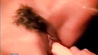 Horny brunette masturbates on the grass