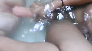Two beautiful lesbians masturbate their pussies while relaxing in the tub - 14 image