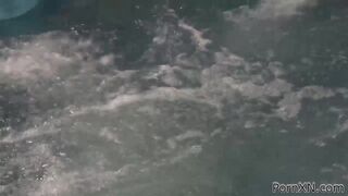 Kinky brunette and redhead get frisky in public pool while fisting each other's wet pussies